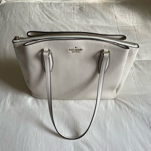 • cream Kate spade purse
